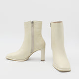 Indigo heeled ankle boots in off white leather womens shoes