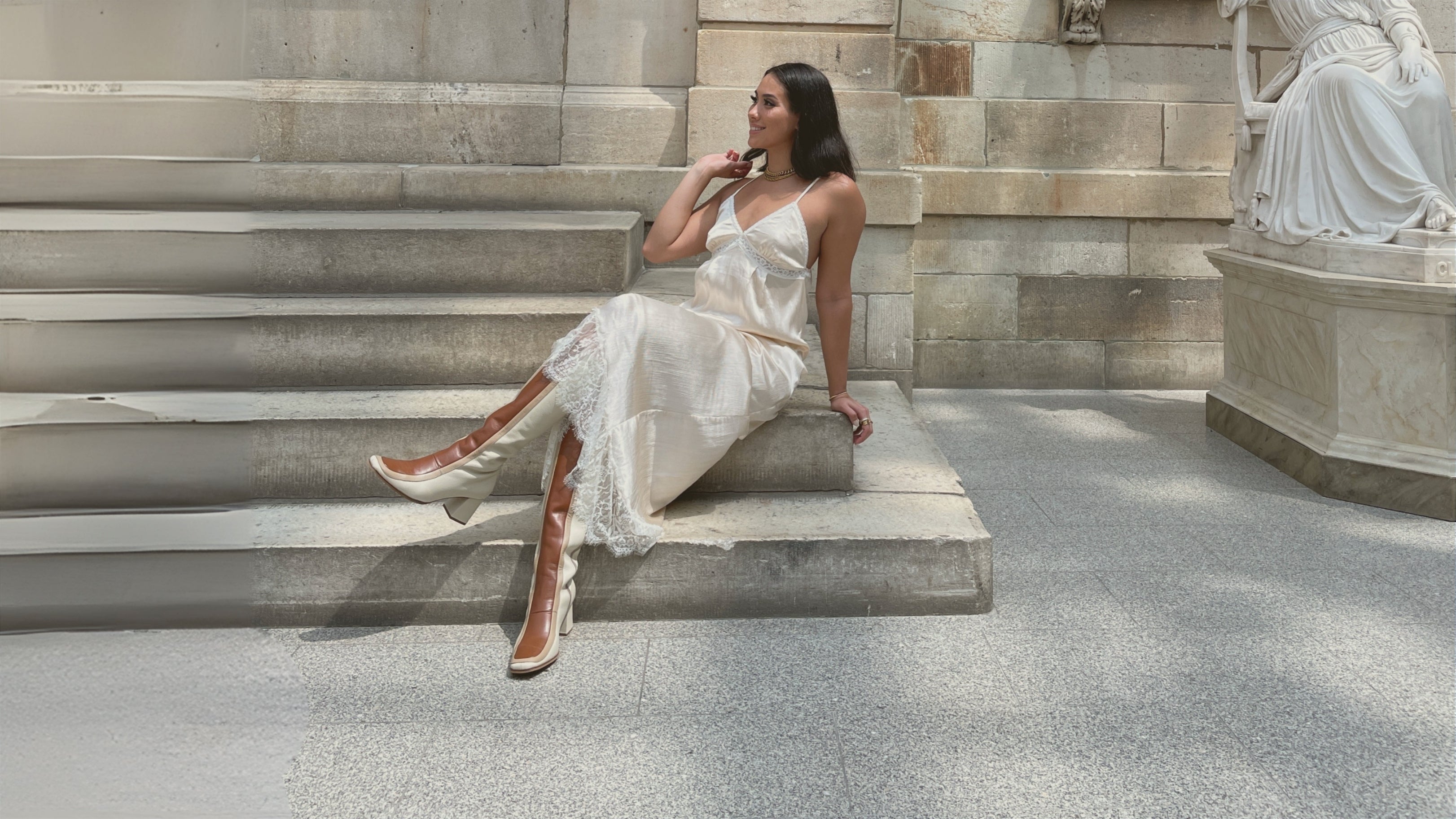 revival_retro_boots_in_off_white_leather_by_stivali_new_york in a museaum like the MTE in NYC with timeless sculptures around