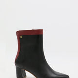 Cerise heeled ankle booties in black/red leather