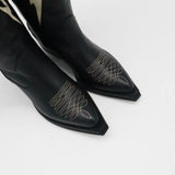 top down view of semi pointed black leather kiss heels 