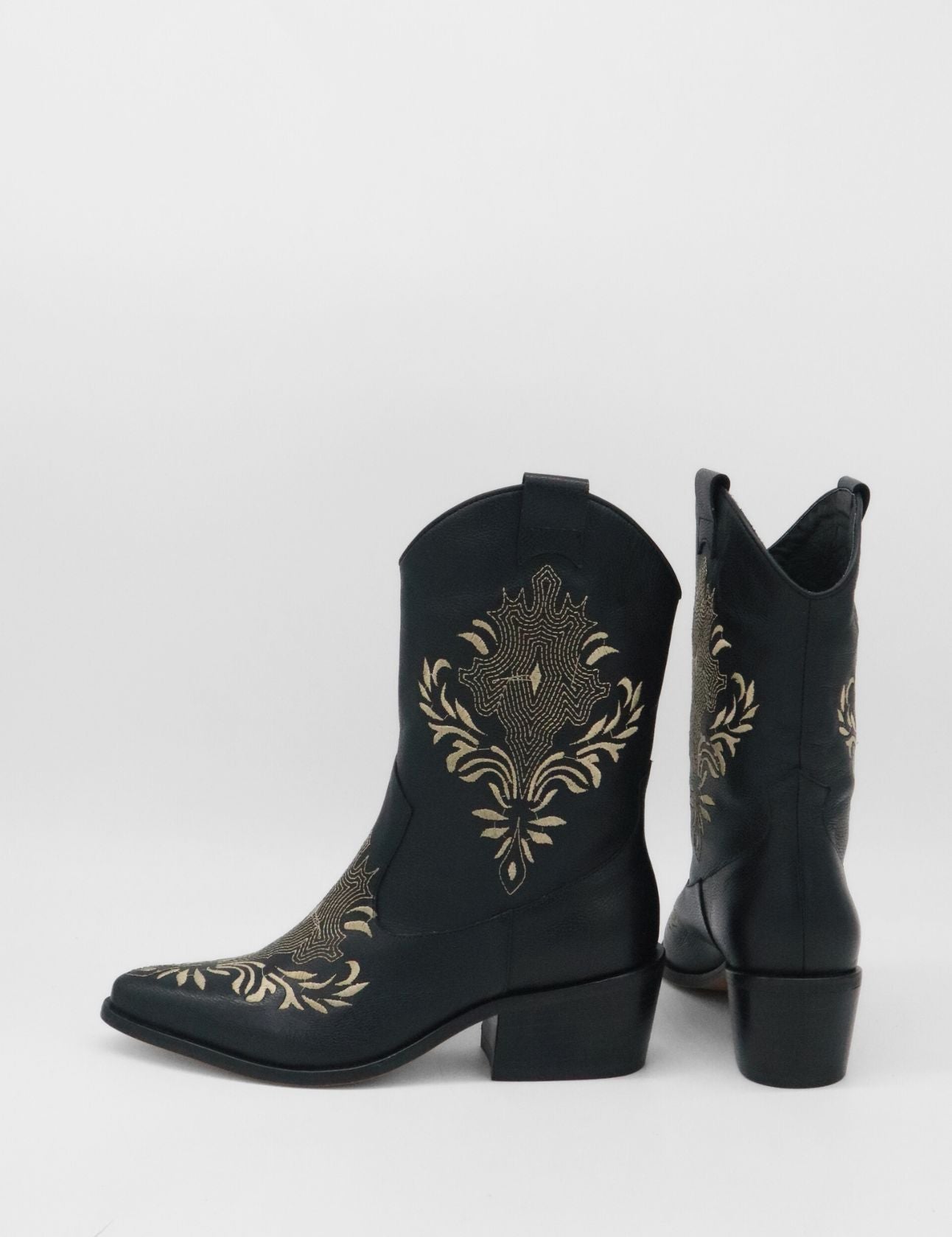 angled back view of black leather knox cowboy boots with side pull on tab and low stacked heel