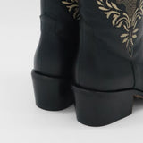 close up of black leather knox boots with stacked heel and embroidery stitching 