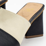 Soulmate block heel open toe mules in ivory/black embossed leather